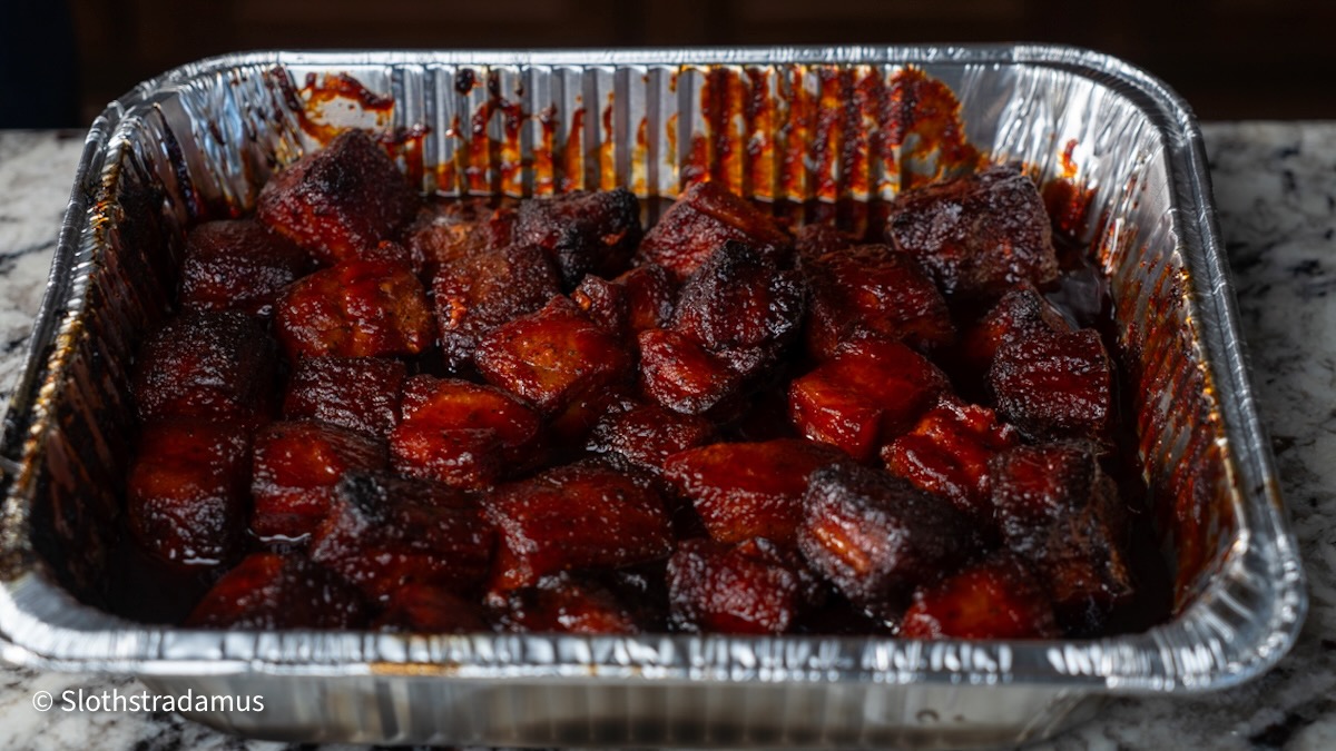 Glazed burnt ends in a foil pan